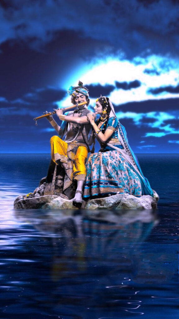 Divine Love: Lord Krishna's Melodies Under Moonlight With Radha Wallpaper