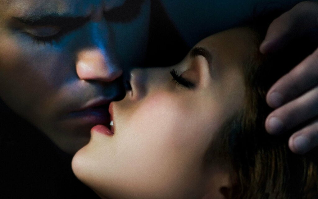 Sensual Thirst: Electrifying Vampire Diaries Moment captured in Stunning HD Wallpaper