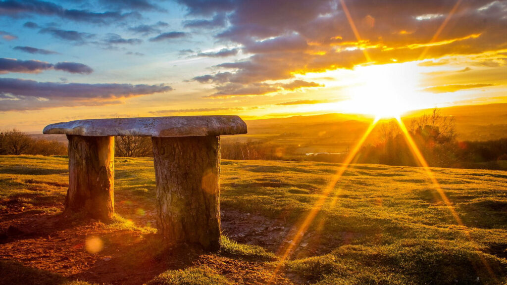Majestic Dawn: Basking in the Serenity of a Mesmerizing Monolith Wallpaper