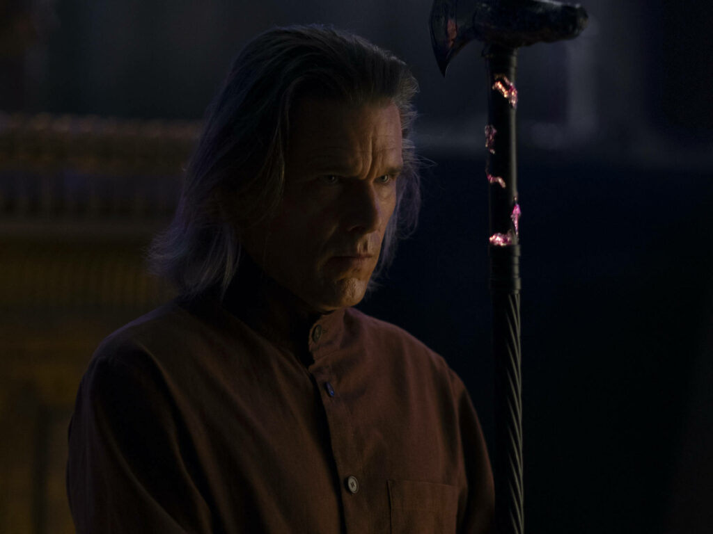 Ethan Hawke as Moon Knight holding glowing mystical staff in dark robe with intense expression Wallpaper