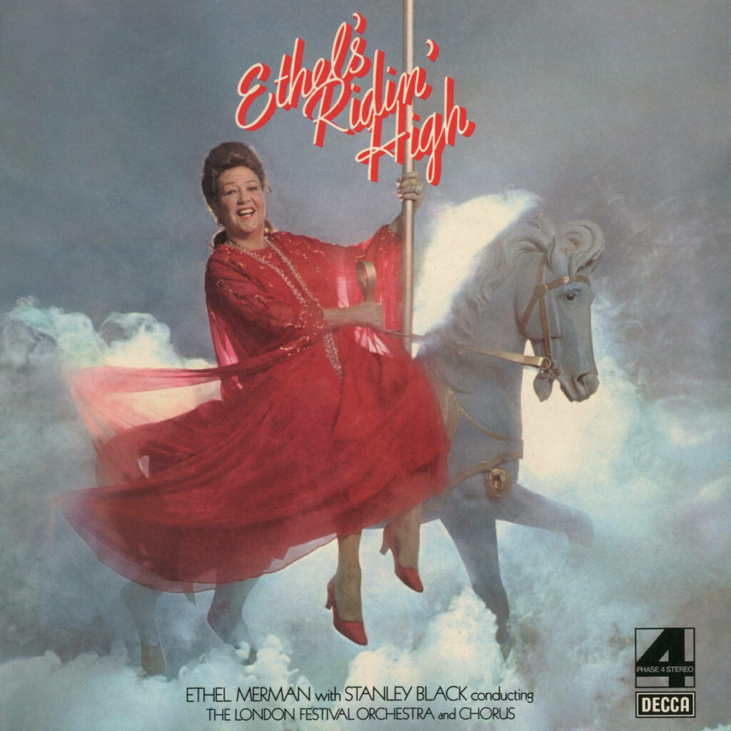Ethel Merman in red dress riding white horse amid dreamy clouds vibrant Ridin High poster wallpaper