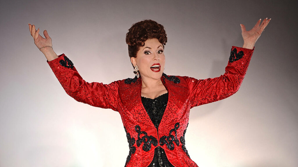 Ethel Merman singing passionately in vibrant red sparkling jacket against soft gradient background Wallpaper