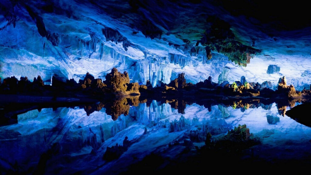 Stunning Cave Interior Wallpaper with Ethereal Blue Light Background
