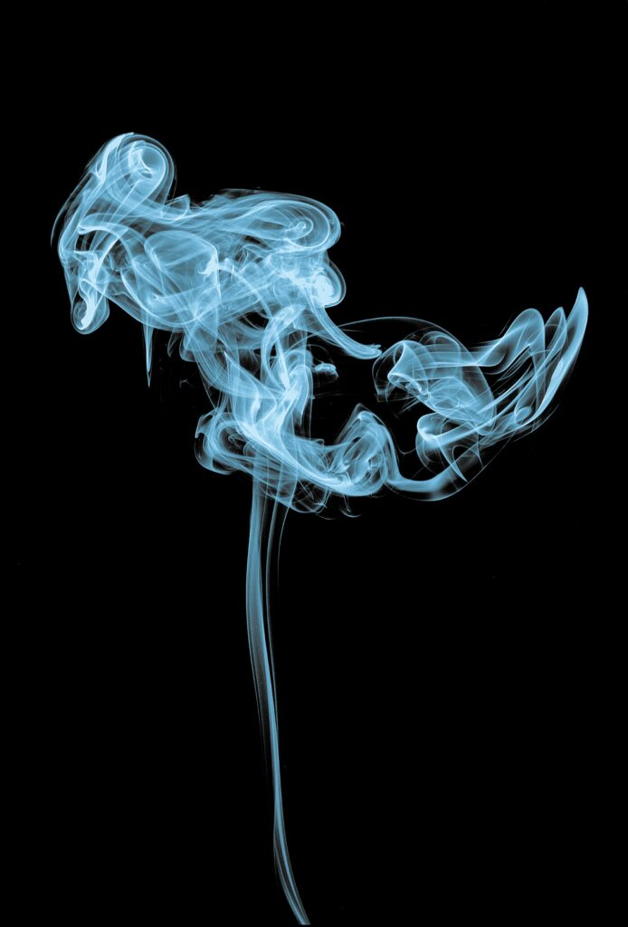 Intricate Blue Smoke Coils Wallpaper on Dark Background - Mysterious Look