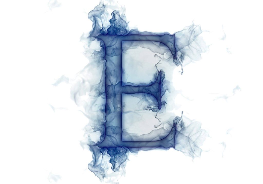 Elegant digital art wallpaper of capital E formed by smoky blue trails on white background