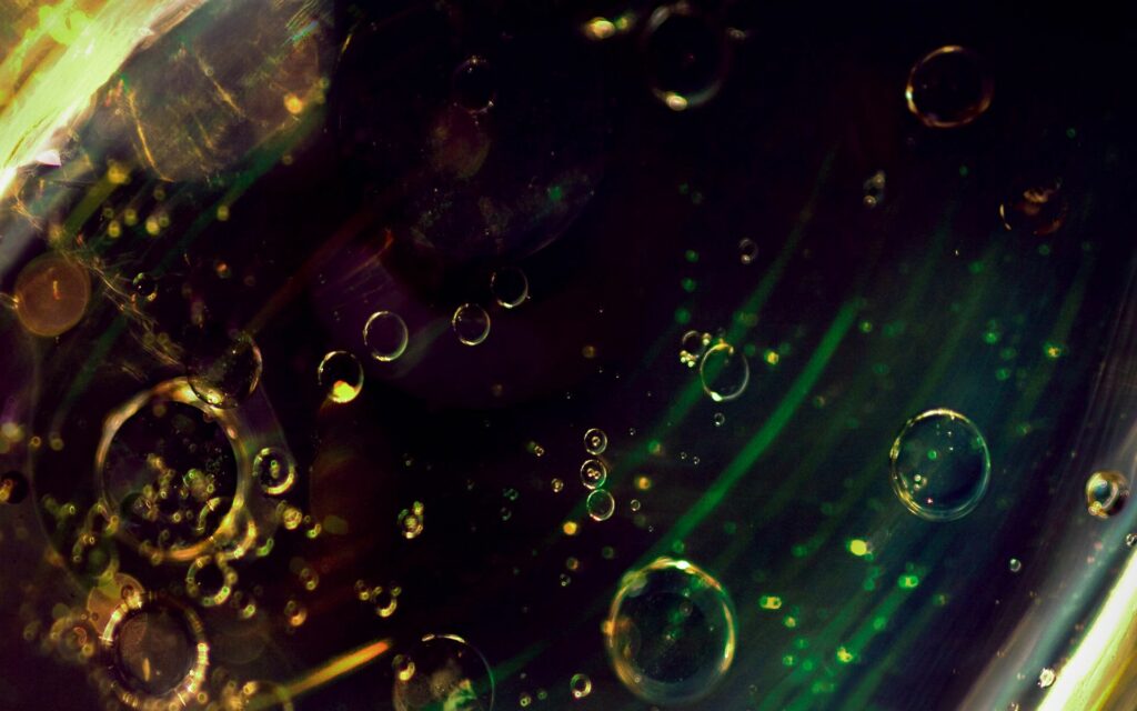 Mesmerizing Close-Up of Bubbles in Dark Liquid Wallpaper Background