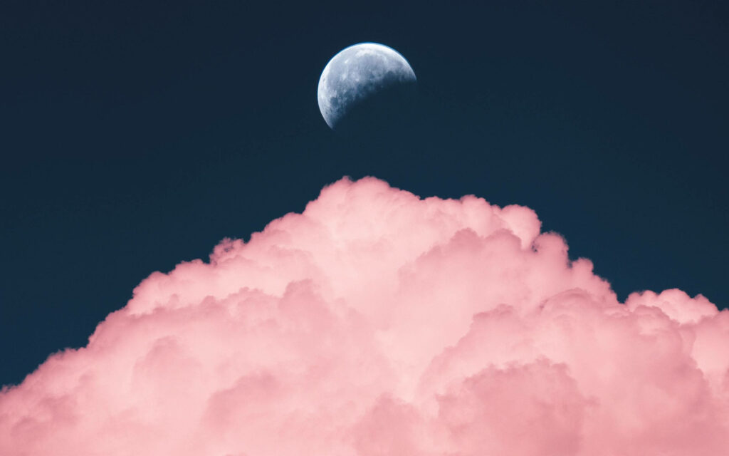 Moonlit Majesty: A Breathtaking Macbook Pro Aesthetic HD Wallpaper Showcasing the Serene Half Moon Amidst Pink Clouds