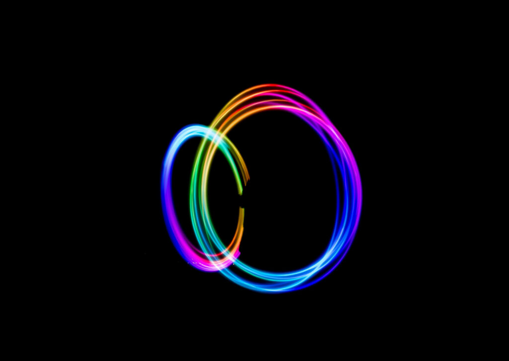 Colorful Circles Emerged from Darkness: A Vibrant Abstract Masterpiece Wallpaper