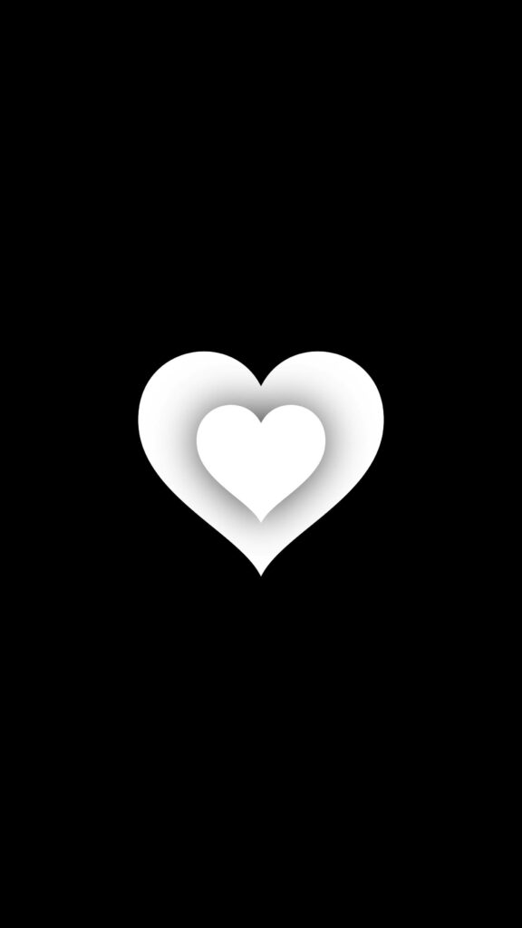 Glowing Heart within an Enchanting Black and White Heart Wallpaper