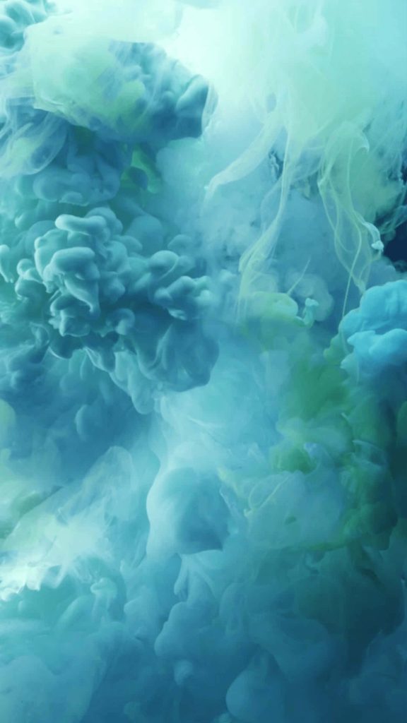 Abstract teal and turquoise ink swirls in liquid creating a calming iPhone wallpaper background
