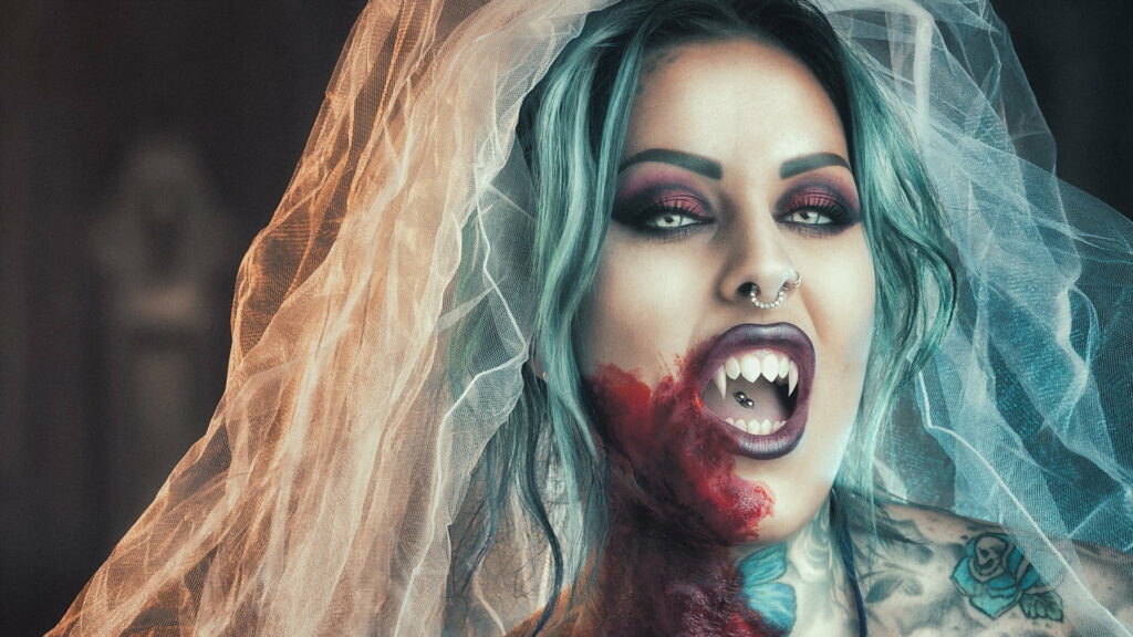 Enchanting Vampire Mistress: A Stunning HD Wallpaper of a Seductive Fantasy Beauty with Intricate Makeup and Nose Rings