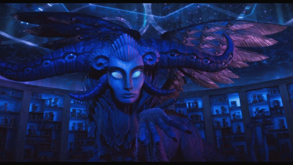 Wood Sprite from Guillermo del Toro’s Pinocchio glowing eyes intricate wings dark magical chamber Wallpaper