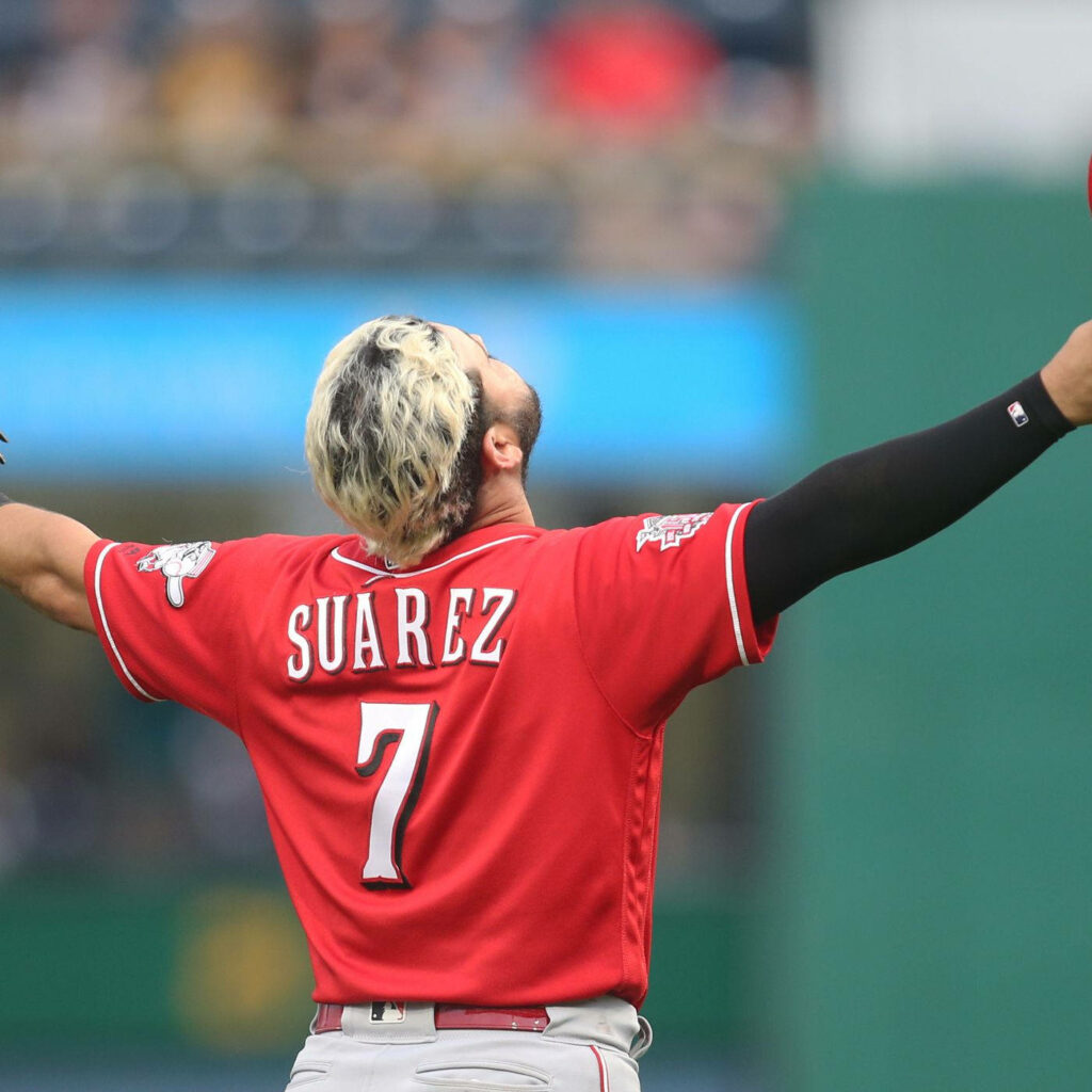 Eugenio Suárez celebrating in red jersey number 7 with arms wide open vibrant baseball wallpaper
