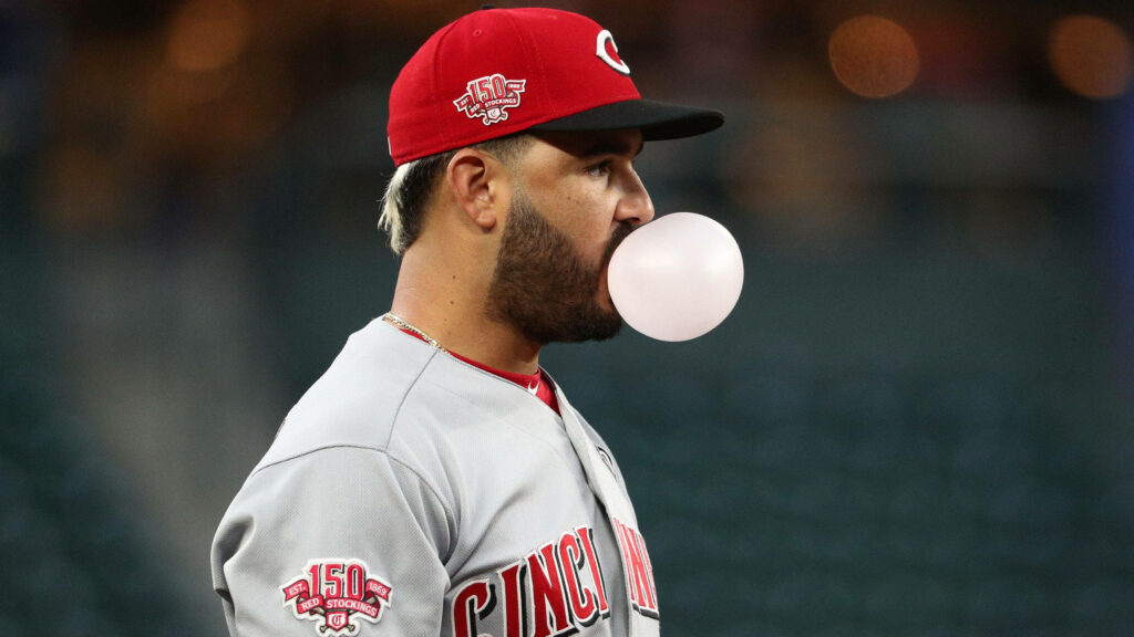 Eugenio Suárez Cincinnati Reds blowing bubble gum vibrant team colors sports wallpaper background