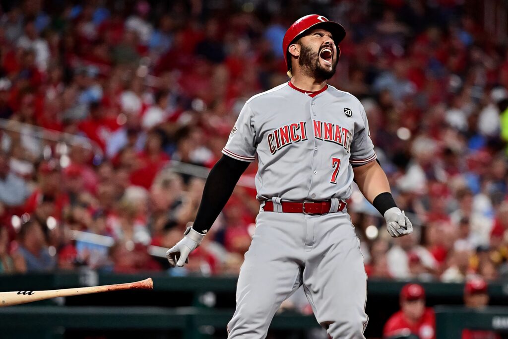 Eugenio Suárez Cincinnati Reds gray red uniform celebrating on field energetic baseball wallpaper