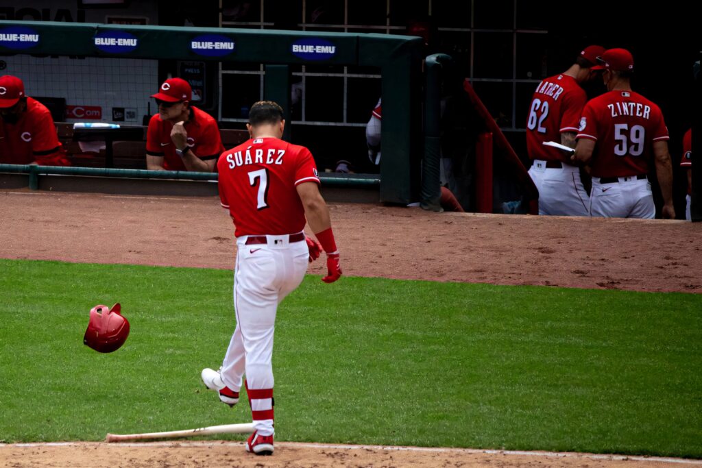 Eugenio Suárez Cincinnati Reds number 7 jersey frustrated helmet kick intense baseball moment Wallpaper