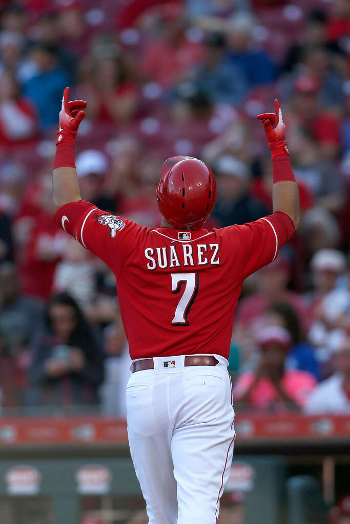Eugenio Suárez in red Cincinnati Reds uniform number 7 celebrating on baseball field wallpaper