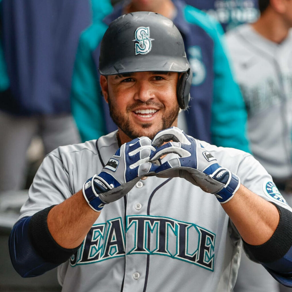 Eugenio Suárez Seattle Mariners confident smile gesture teammates baseball energy wallpaper background
