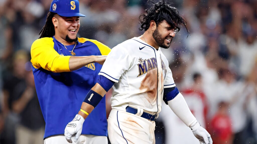 Eugenio Suárez and Luis Castillo celebrating on baseball field vibrant team spirit wallpaper background