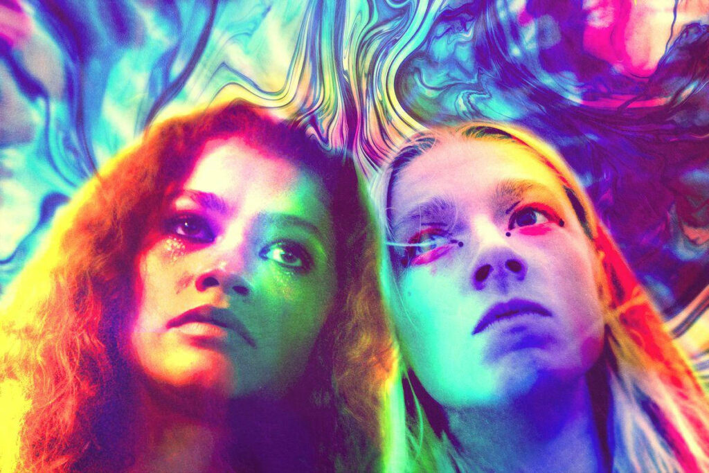Vibrant Euphoria Wallpaper: Rue & Jules in Psychedelic Connection