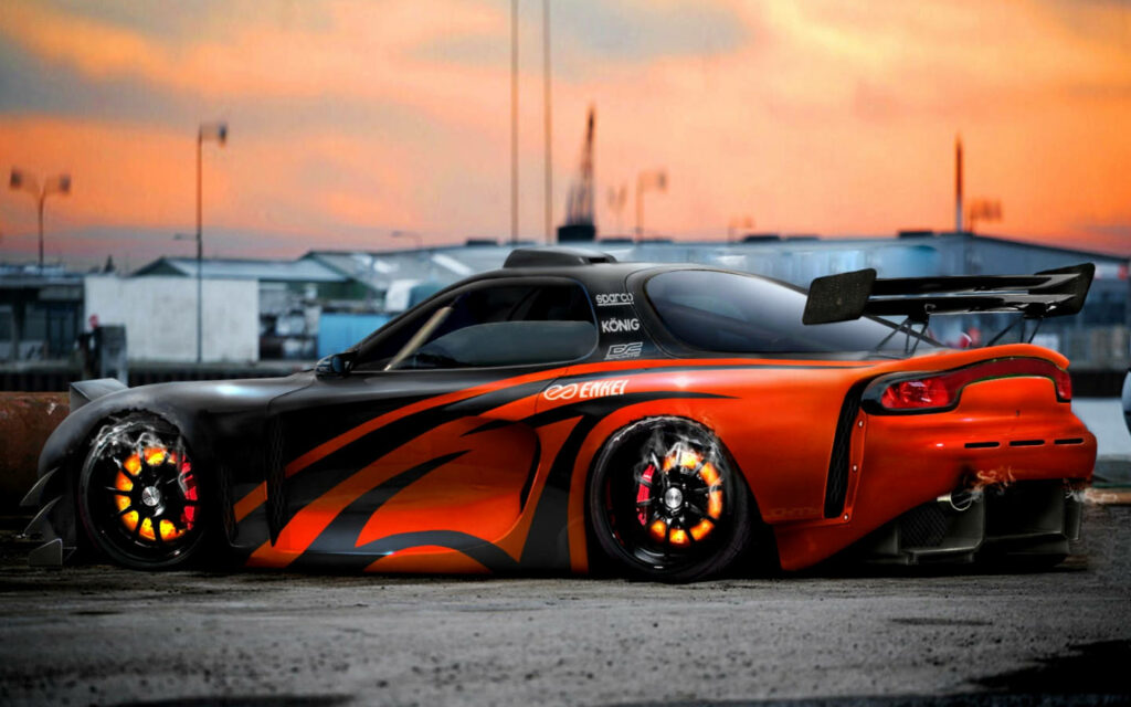 Blazing Sunset Encounter: The Sleek Rx7 Ignites the Sky in a Fiery Display Wallpaper