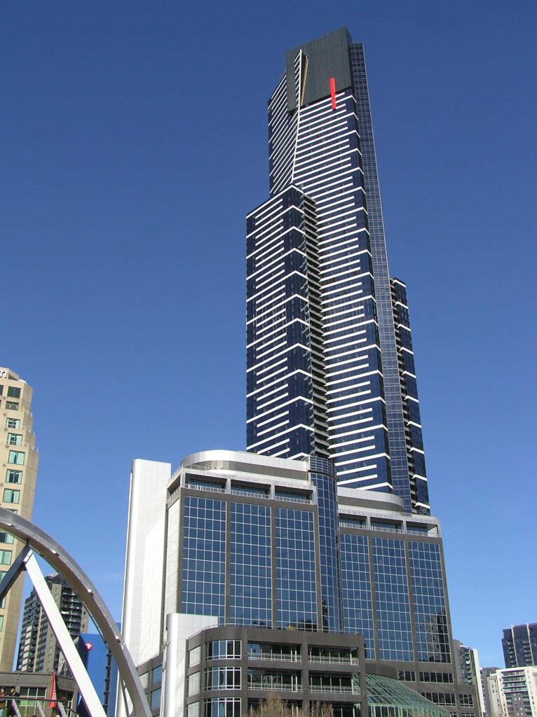 Eureka Tower Melbourne skyscraper with sleek glass façade bold lines blue sky urban Victoria Wallpaper