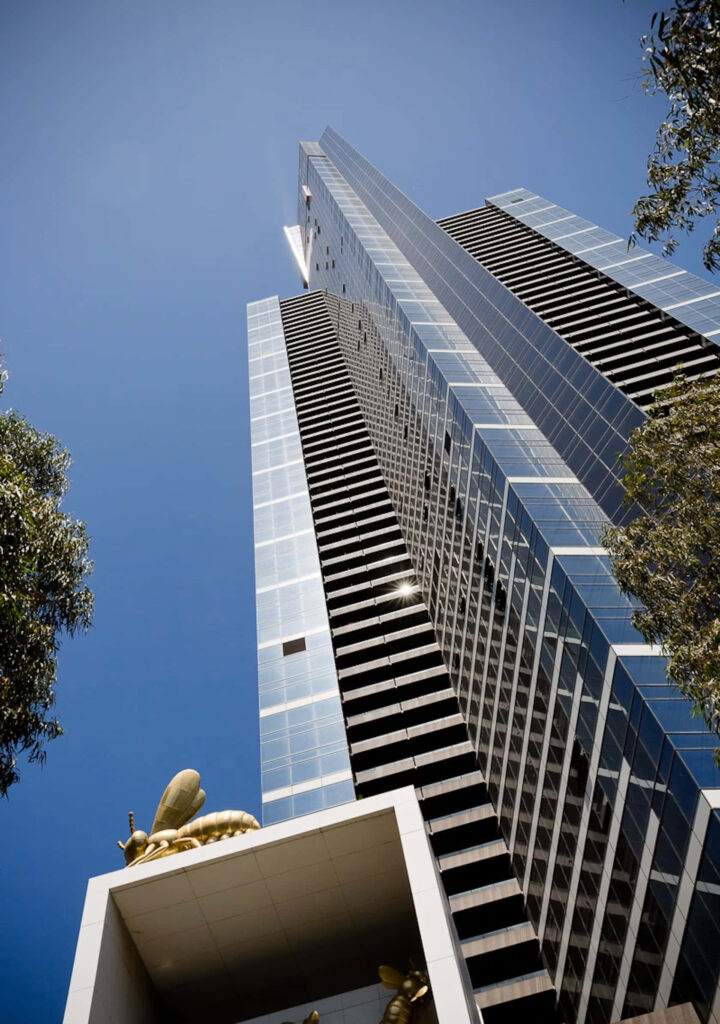 Eureka Tower Melbourne skyscraper modern architecture blue sky golden accents wallpaper background