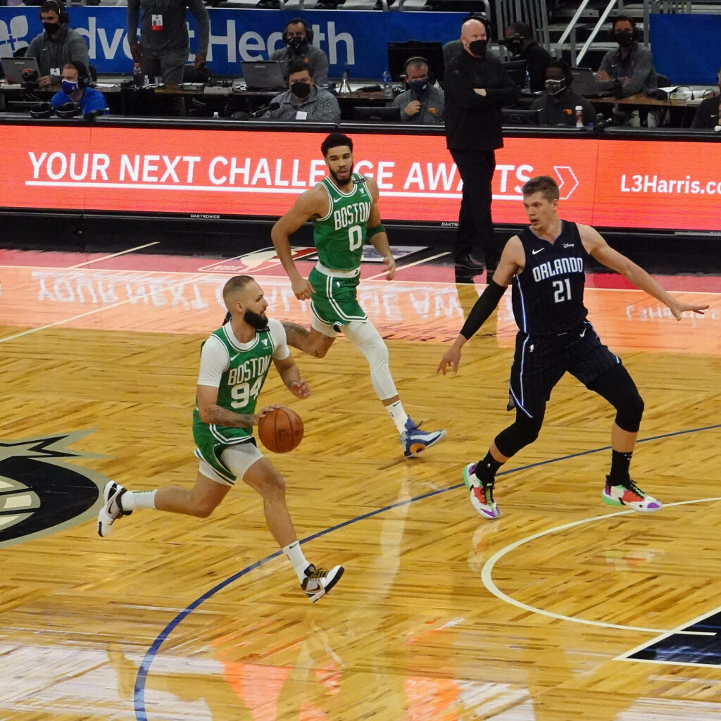 Evan Fournier defends Jayson Tatum Marcus Smart Celtics vs Magic NBA action on polished court wallpaper