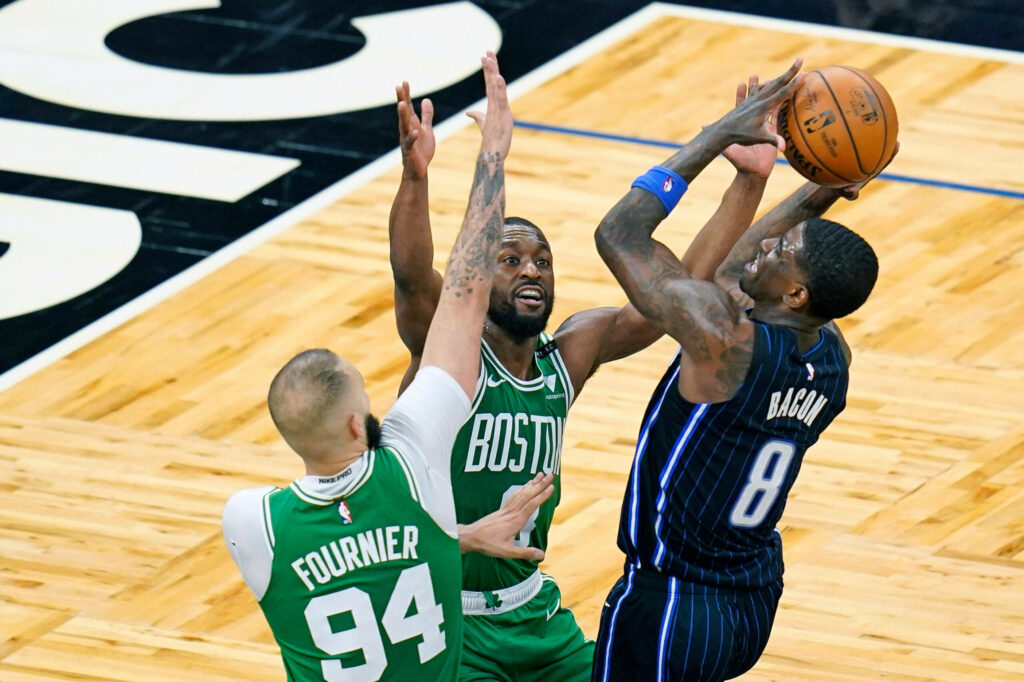 Evan Fournier and Dwayne Bacon intense NBA action basketball wallpaper vivid green blue jerseys
