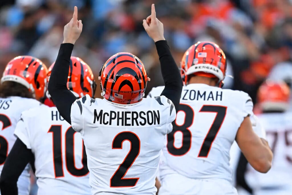 Evan McPherson Cincinnati Bengals kicker celebrating on field in white orange uniform wallpaper