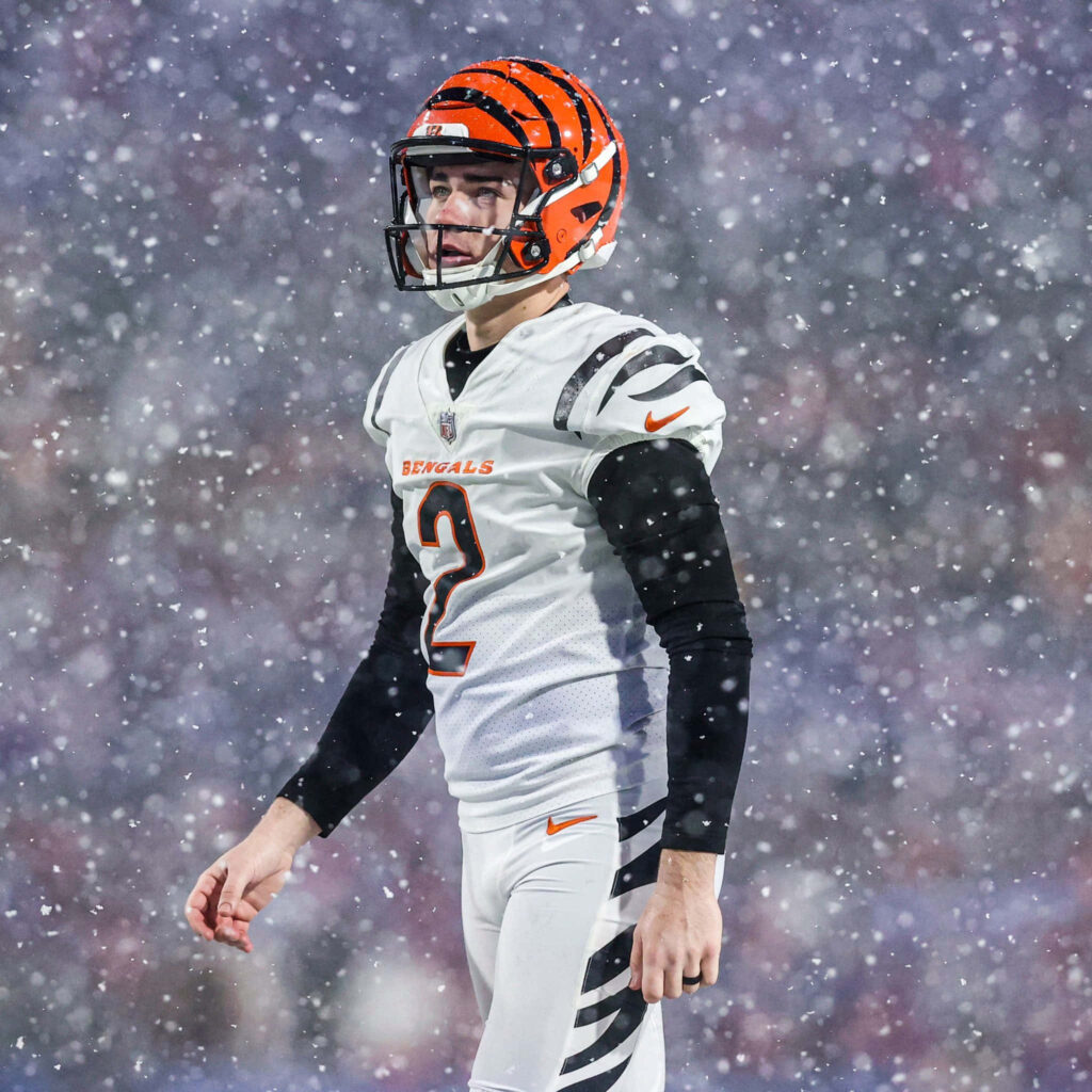 Evan McPherson Cincinnati Bengals focused on snowy field intense game day sports wallpaper background