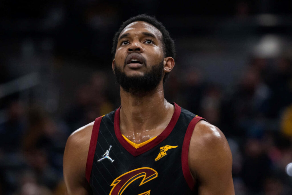 Evan Mobley in Cleveland Cavaliers jersey with maroon gold accents intense game-time pose wallpaper