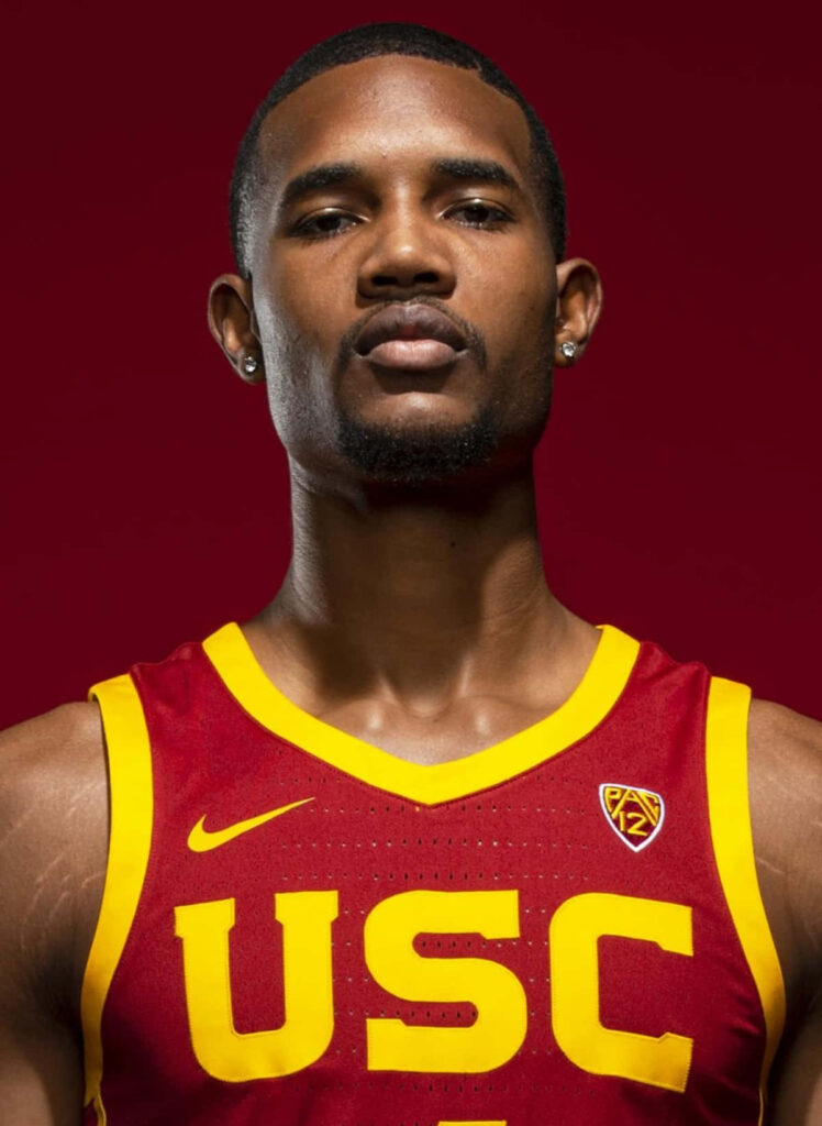 Evan Mobley in USC basketball jersey close-up intense portrait deep red background wallapper Wallpaper
