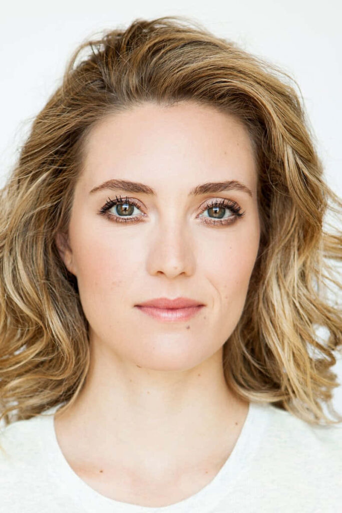 Evelyne Brochu high resolution portrait with soft natural light and tousled blonde hair on white background Wallpaper