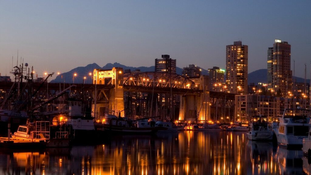 Evening Harbor Wallpaper: Yachts, City Lights & Scenic Reflections