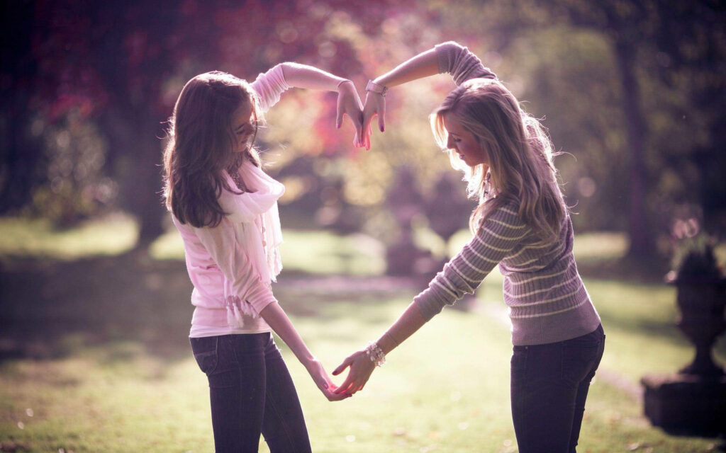 Inseparable Duo Capturing Their Bond at the Park - Best Friends Forever Wallpaper