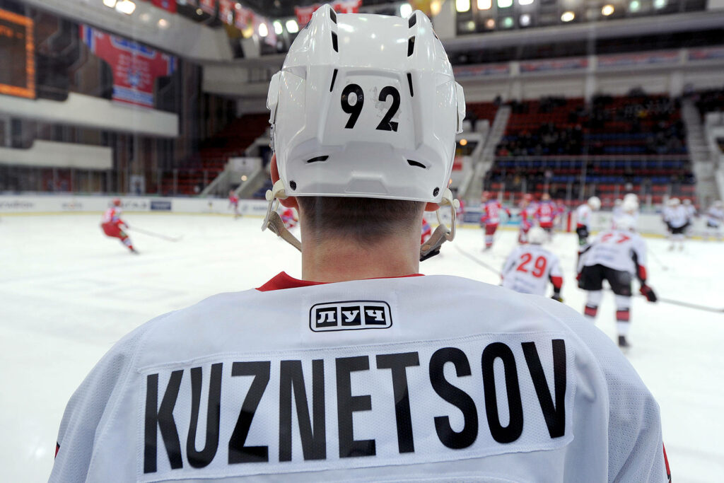 Evgeny Kuznetsov hockey wallpaper back view Jersey 92 sharp focus indoor arena energy background