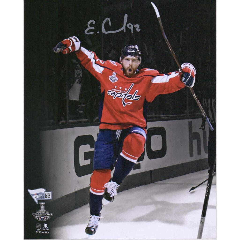 Evgeny Kuznetsov celebrating victory on ice in red Washington Capitals jersey dynamic wallpaper