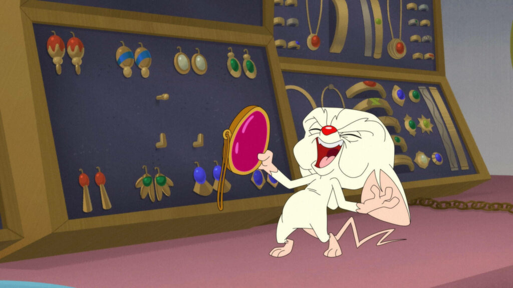 The Brain from Animaniacs laughs evilly holding mirror near colorful jewelry displays wallpaper