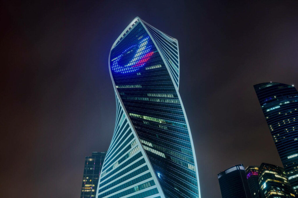 Evolution Tower Moscow night view showcasing twisting architecture city skyline wallpaper background