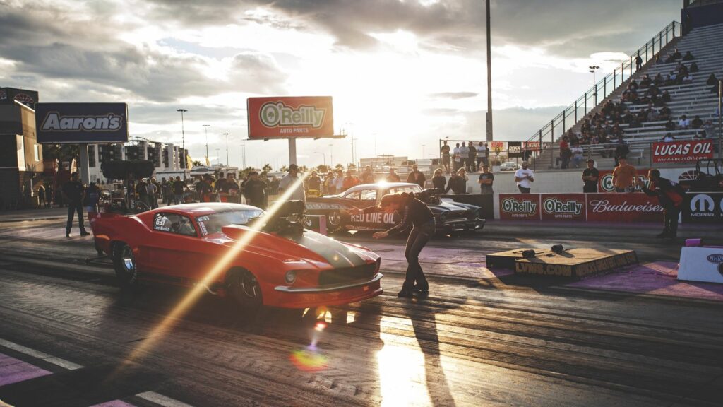 Thrilling Drag Racing Wallpaper: Classic Red Ford Mustang in Action
