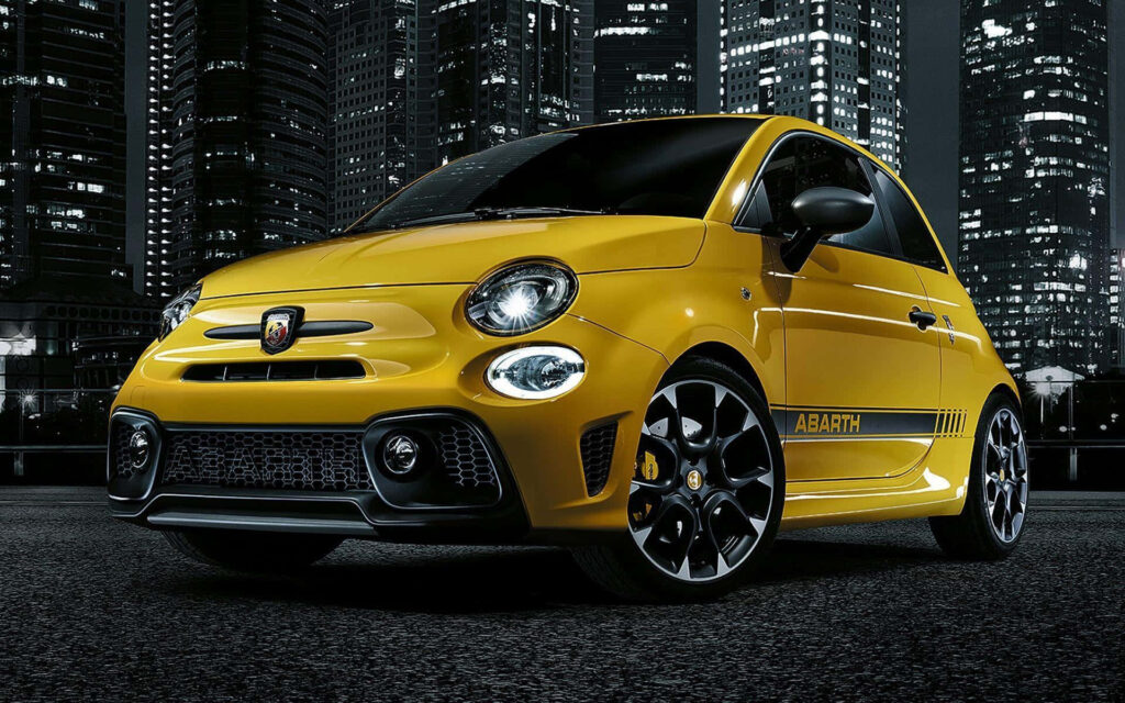 Yellow Abarth Spider 124 Rallye - Night Cityscape Background Wallpaper