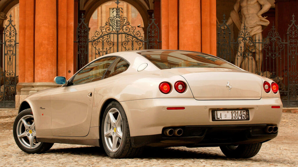 Exhilarating Journey: The Majestic Ferrari 612 Scaglietti Dominating a Breathtaking Road Wallpaper