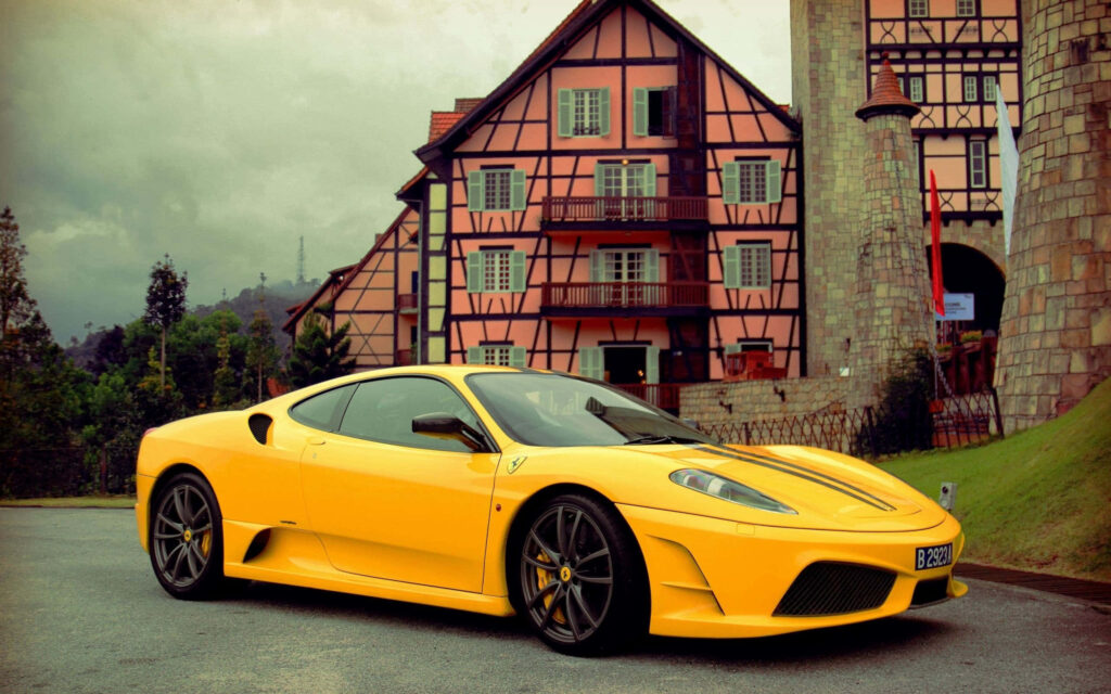 The Timeless Thrills of the Iconic Ferrari F430, Captured in Red Perfection on a Scenic Drive Wallpaper