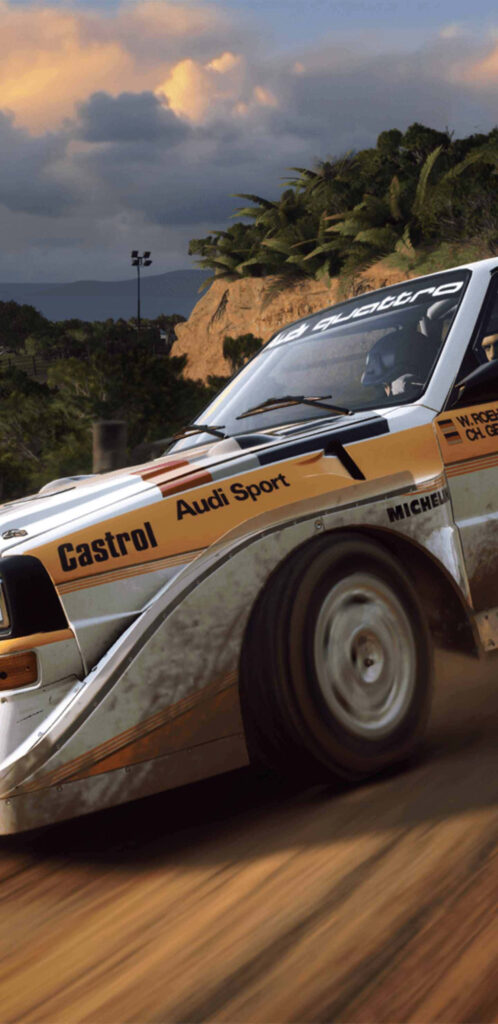 Classic Audi Sport Rally Car in Action: Castrol, Michelin, Sunset Sky - Thrilling Motorsport Wallpaper