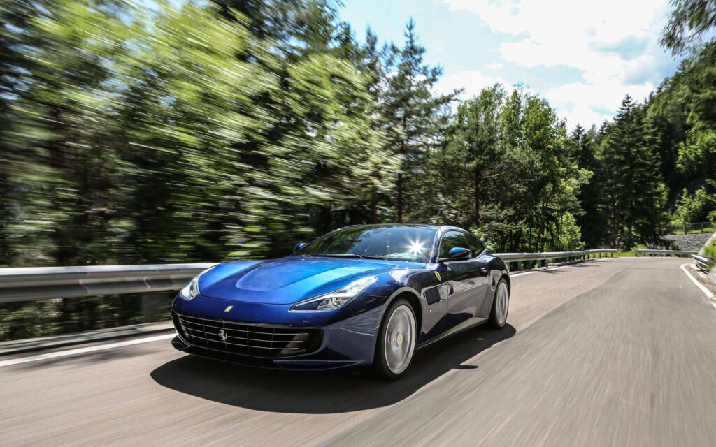 Unleashing the Adrenaline: Marvel at the Dazzling Red Ferrari Gtc4lusso Racing with Unmatched Power on an Open Road Wallpaper