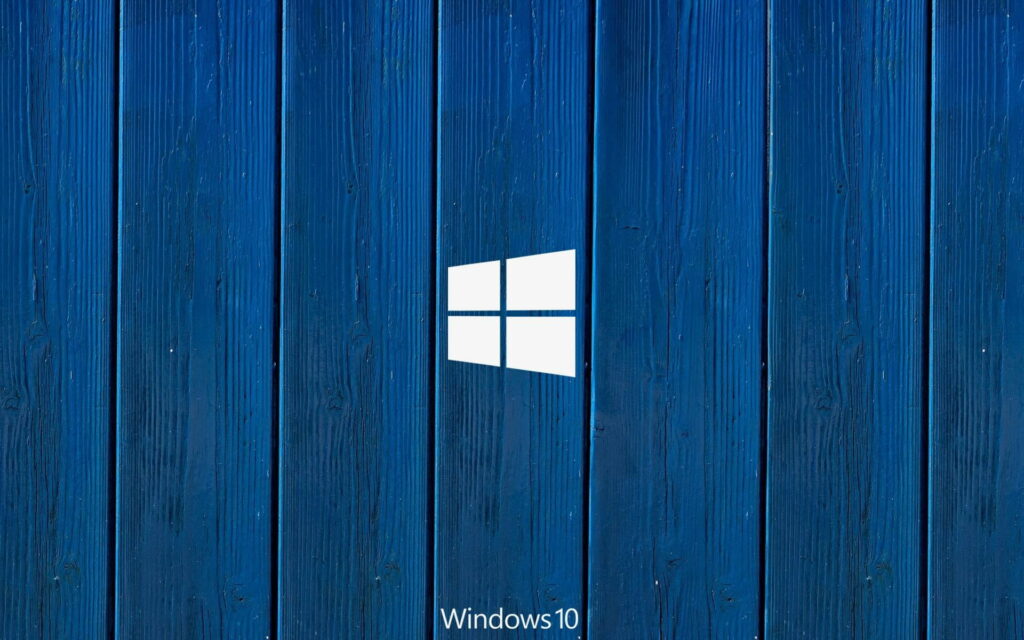 Minimalist Windows 10 wallpaper with white logo on deep blue textured wooden plank background