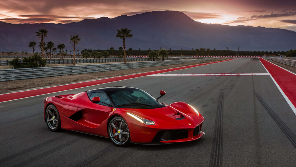 Unleash Your Inner Speed Demon: Embark on a Legendary Drive in a Stylish Italian Icon Wallpaper