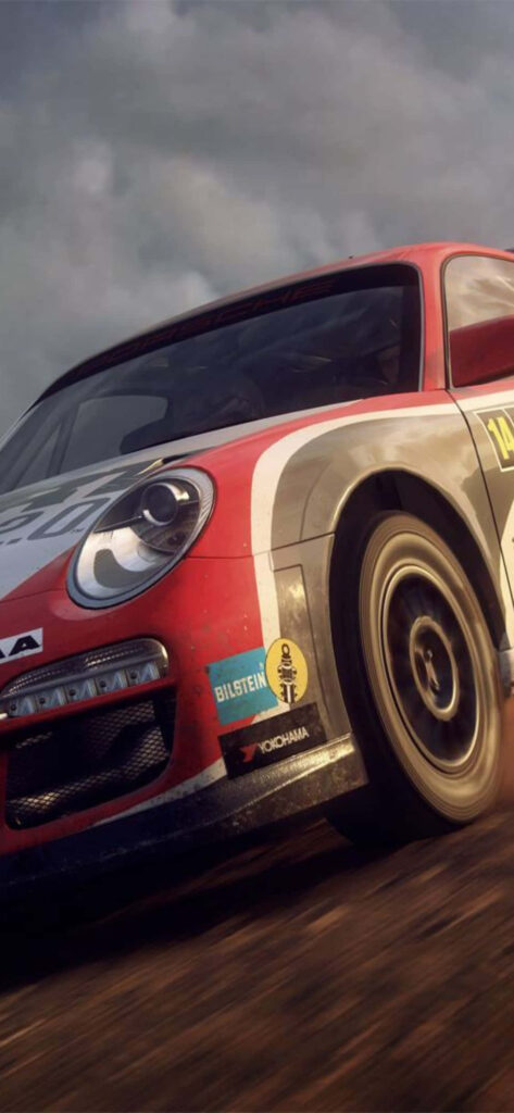 High-speed dirt rally car close-up on track: action-packed wallpaper