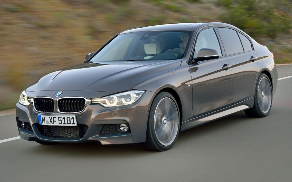 Silver BMW M Series Car on Road Wallpaper